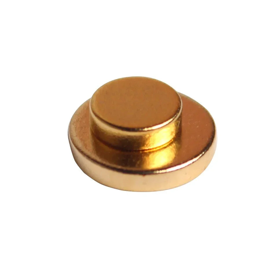Round gold-tone metal snap button for streetwear clothing and accessories