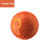 Orange textured massage ball with circular pattern and rubber material