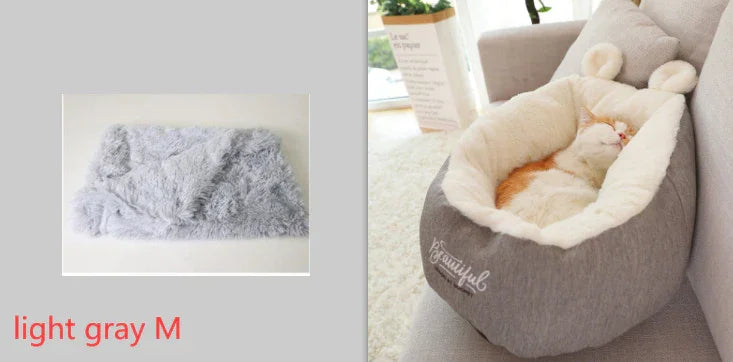 Light gray medium pet bed with soft faux fur material and cozy fit, shown with a cat sleeping inside.
