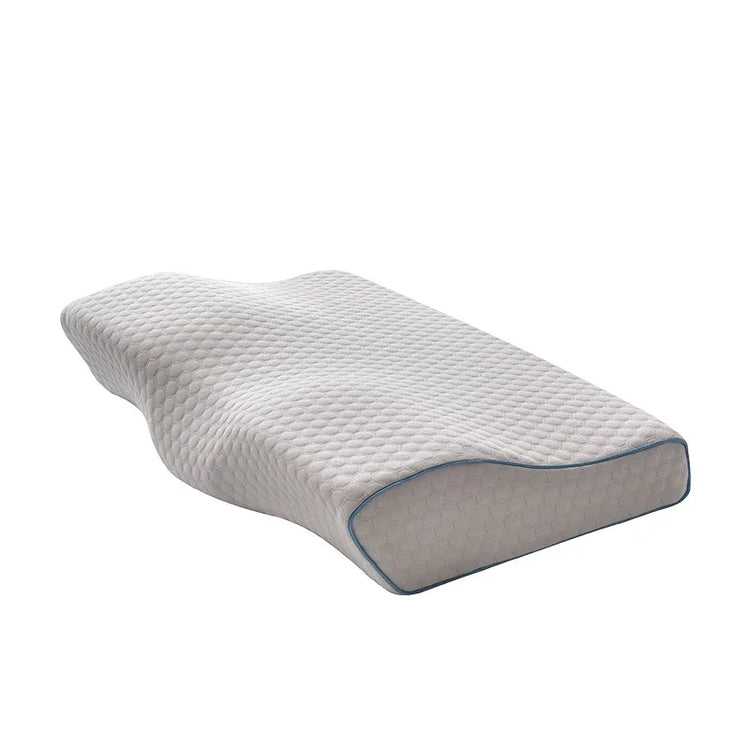 Ergonomic memory foam pillow with contoured shape and textured white cover