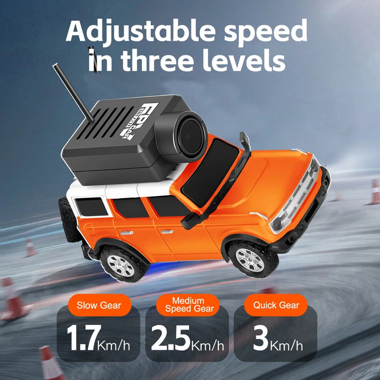 Orange and white RC SUV toy car with adjustable speed settings, shown on a racetrack background.