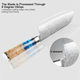 Chef knife with Damascus steel blade, V-shaped edge, and blue resin wood handle, close-up view