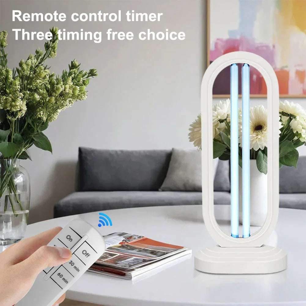 Modern U-shaped white UV sterilization lamp with remote control on a living room table, floral decor nearby.