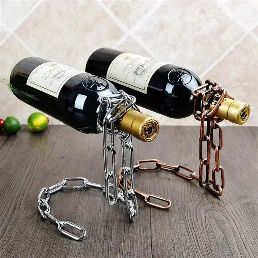 Metal chain wine bottle holders in silver and bronze colors on a wooden surface