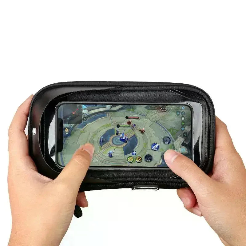 Hands holding a smartphone inside a black transparent touchscreen pouch, gaming accessory