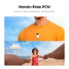 Orange crewneck tee with chest-mounted POV camera, worn on sunny beach for hands-free 2.7K video capture
