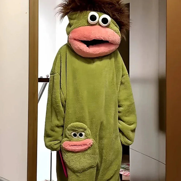 Green plush character onesie with oversized fit, fuzzy texture, and unique cartoon face details.