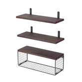 Set of three floating wooden wall shelves, two plain and one with a metal wire basket, modern minimalist style.