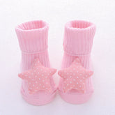 Pink ribbed baby socks with soft star-shaped, polka dot accents, cozy cotton knit.
