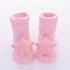 Pink ribbed baby socks with soft star-shaped, polka dot accents, cozy cotton knit.