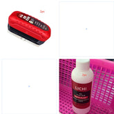 Red handheld cleaning tool and refill liquid bottle for cleaning surfaces, shown in a pink basket