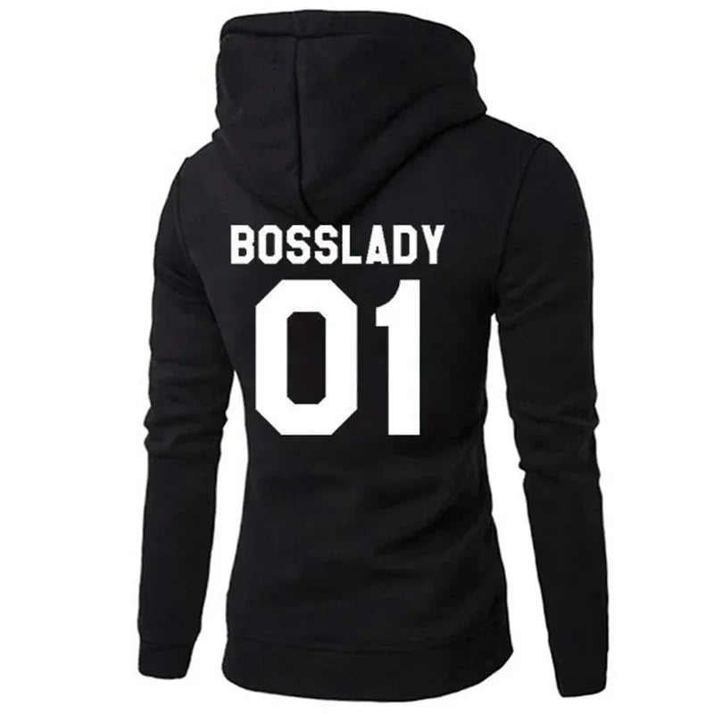 Black fitted hoodie with bold white 'Bosslady 01' print on back, streetwear style.