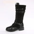 Black knee-high lace-up boot with buckle straps, chunky sole, and leather details
