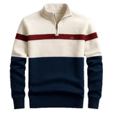 Colorblock quarter zip sweater with cream, navy, and red stripes, ribbed cuffs, and relaxed fit.