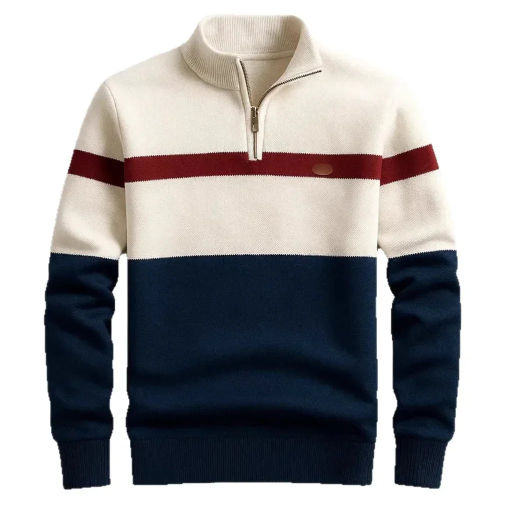 Colorblock quarter zip sweater with cream, navy, and red stripes, ribbed cuffs, and relaxed fit.