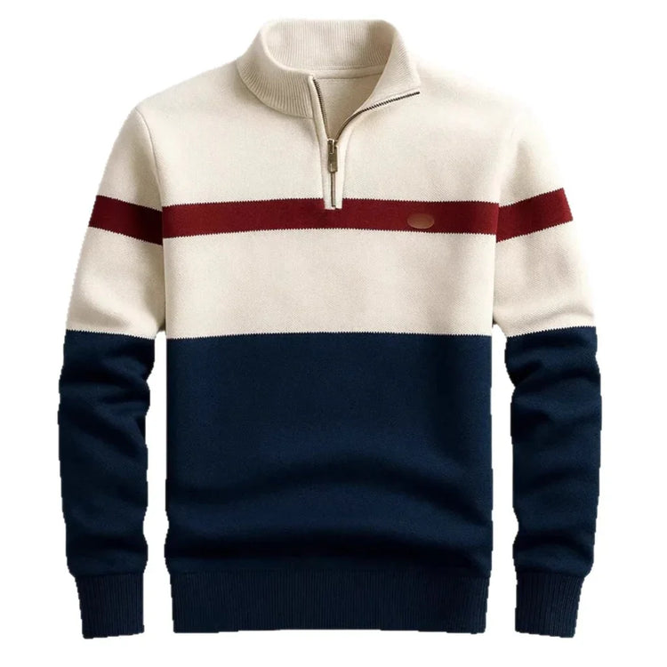 Colorblock quarter zip sweater with cream, navy, and red stripes, ribbed cuffs, and relaxed fit.