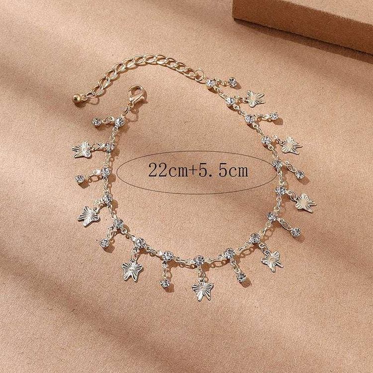 Gold anklet with leaf charms and crystal accents, adjustable chain, modern streetwear accessory