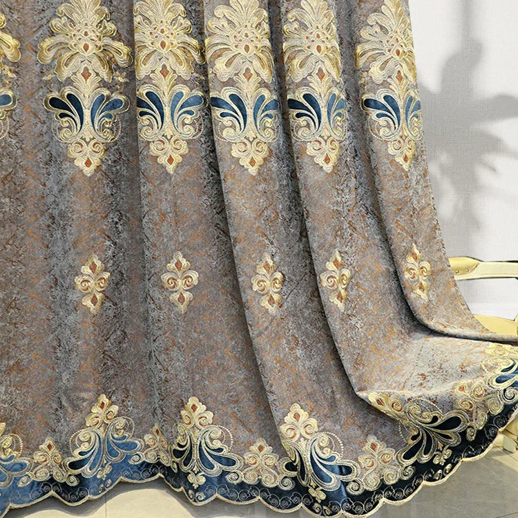 Gray and gold embroidered velvet curtain with blue accents and ornate floral patterns