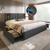 Modern gray upholstered platform bed with storage drawers, tech charging features, and neutral bedding.