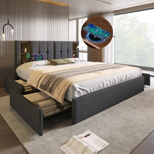 Modern gray upholstered platform bed with storage drawers, tech charging features, and neutral bedding.