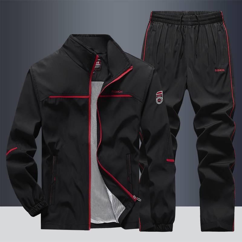Black streetwear tracksuit with red accents, lightweight material, relaxed fit