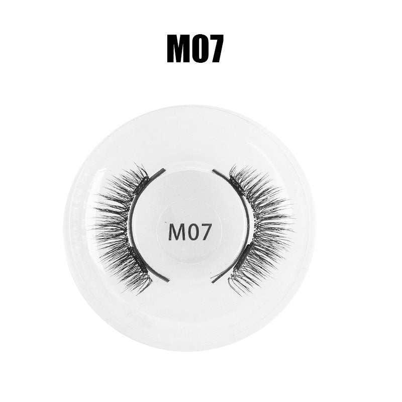 Black synthetic false eyelashes M07 style in a round clear plastic case.
