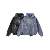 Oversized streetwear hoodies in faded black and blue, featuring cross and paint splatter print.
