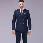 Man wearing navy blue double-breasted suit, gold buttons, slim fit, formal attire