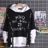 Black and white oversized graphic hoodie with bold streetwear lettering, drawstrings, layered look.