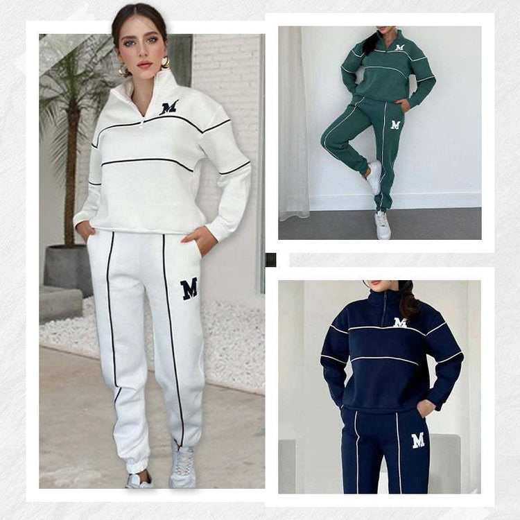 Women’s fleece tracksuits in white, green, and navy with zip collar, contrast piping, relaxed fit.
