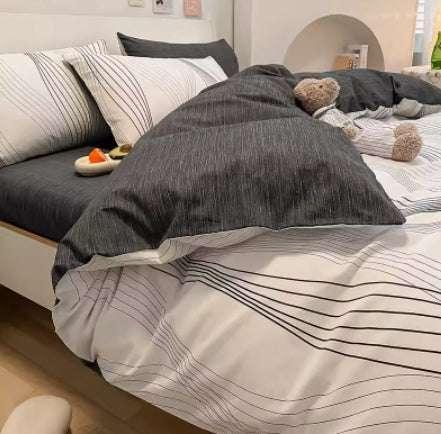 Modern bedding with gray and white striped duvet and pillowcases, cotton material, relaxed fit