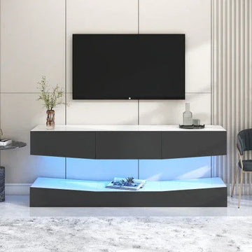 Modern black and white TV stand with LED lighting, glossy finish, and minimalist decor in living room