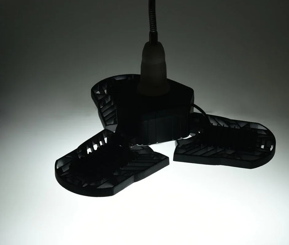 Black adjustable LED ceiling light with three panels, modern industrial style