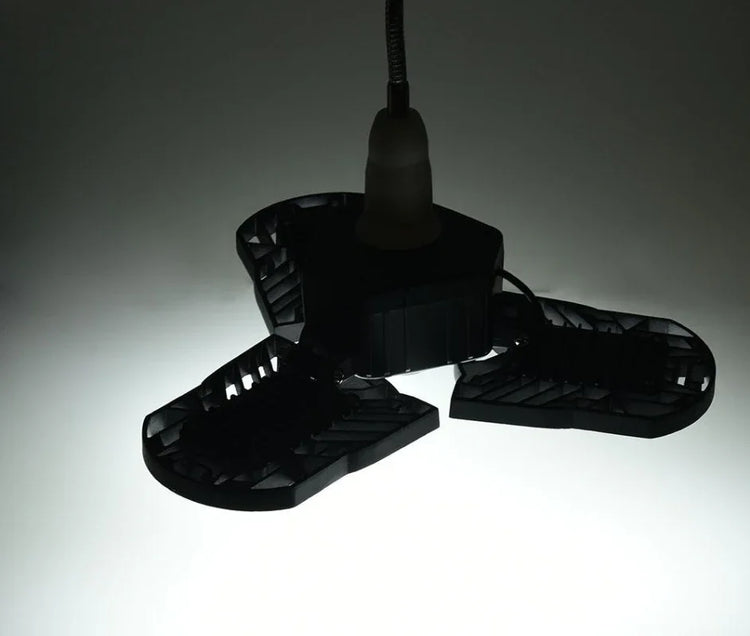 Black adjustable LED ceiling light with three panels, modern industrial style