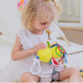 Toddler in white ruffle dress, soft cotton material, loose fit, playing indoors