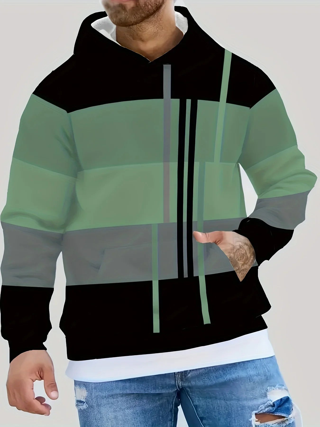 Color-blocked green and black streetwear hoodie with modern geometric design, relaxed fit