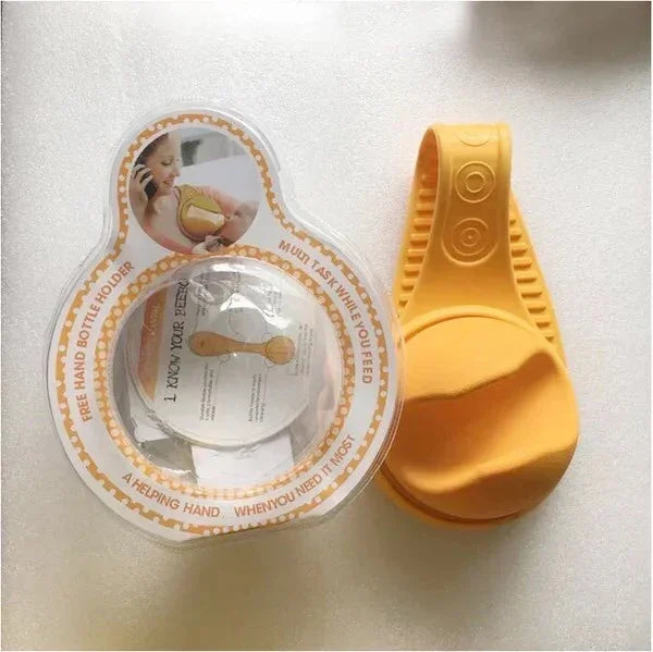 Yellow silicone hands-free baby bottle holder with textured grip and ergonomic fit