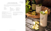 Half Baked Harvest Quick & Cozy cookbook open to coconut ginger mojito recipe with a creamy cocktail garnished with lime and mint on a rustic wooden table