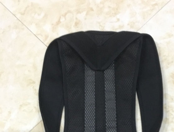 Black breathable spine bending posture corrector with adjustable straps and mesh fabric