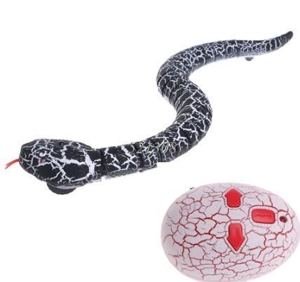 Black and white remote control toy snake with cracked pattern and matching egg-shaped controller
