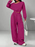 Woman in magenta oversized sweatshirt and wide-leg pants set, relaxed fit, casual streetwear style