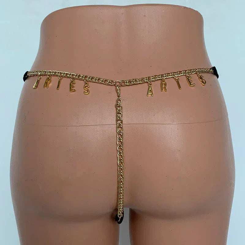 Gold chain waist belt with letter charms, minimal fit, styled on mannequin