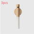 Minimalist wooden and white wall hook, cylindrical design, modern home accessory.