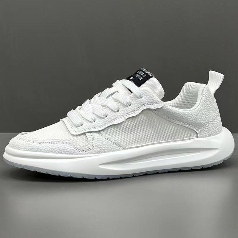 White low-top sneaker with mesh and textured leather panels, thick sole, modern fit