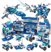 Block toy set with blue and white police vehicles, helicopter, robot, and command truck