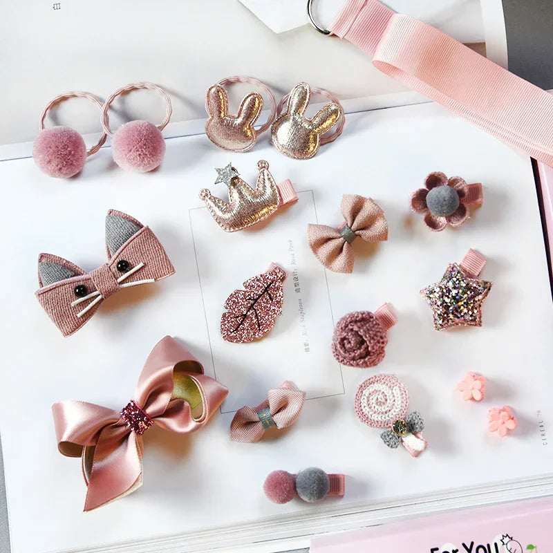 Assorted pink and glittery hair clips in various shapes like bows, stars, crowns, and flowers on a flat lay.