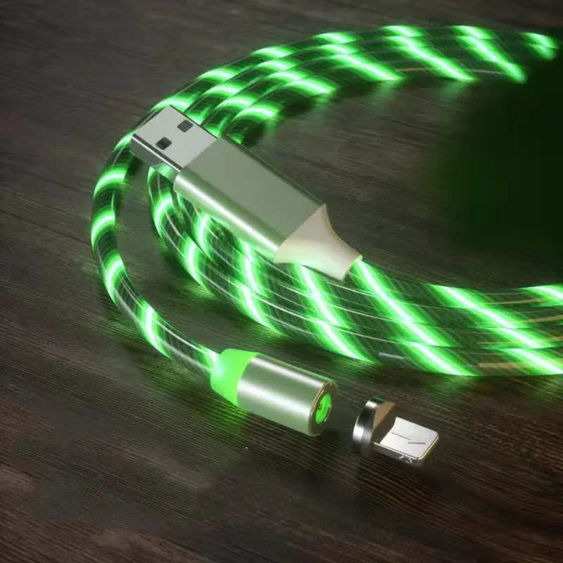Glowing green USB charging cable with magnetic connector on dark wood surface