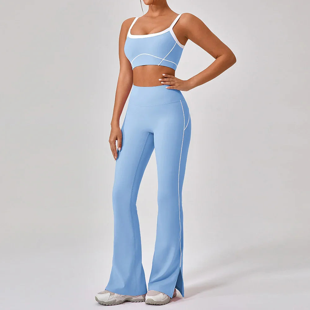Woman wearing light blue fitted crop top and high-waisted flared leggings with white accents