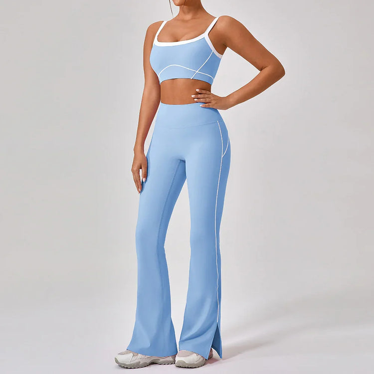 Woman wearing light blue fitted crop top and high-waisted flared leggings with white accents