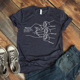 Dark gray cotton t-shirt with hand-drawn illustration and personalized name labels, relaxed fit.